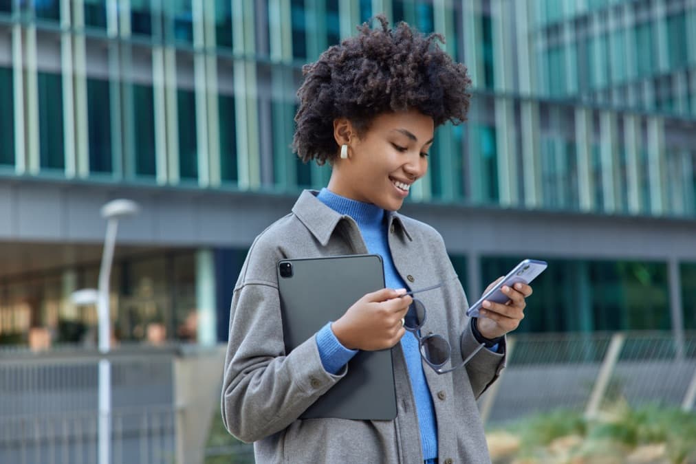 Woman tracking shipment on phone and tablet